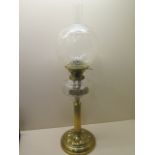 A brass oil lamp with an etched glass shade and Hinks no 2 burner and cut glass reservoir - Height