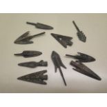 A collection of ten assorted metal replica arrowheads
