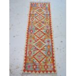 A hand knotted woollen Chobi Kilim runner - 192cm x 62cm