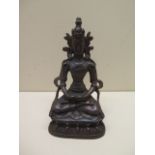 A bronze seated Buddha with patinated finish - Height 16cm