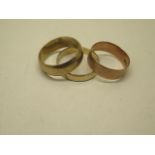 Three hallmarked 9ct yellow gold band rings size Q, P, R band width 6, 6 and 4mm - total approx