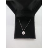 An 18ct white gold eight stone diamond and pearl pendant on a 9ct 18 inch long white gold chain