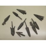 A collection of ten assorted metal replica arrowheads