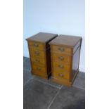 A pair of mahogany four drawer pedestal bedside chests adapted from an Edwardian desk