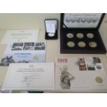 A silver proof £5 75th Anniversary D-Day coin, a British Army six medal commemorative set and two