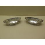 A pair of hallmarked Victorian silver bon bon dishes - Length 14cm - some small splitting and wear