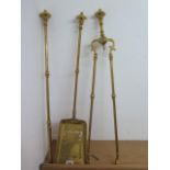 A brass and steel Victorian fire set in polished condition, 67cm tall