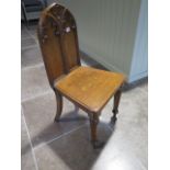 A 19th century Gothic style hall chair in polished condition - Height 50cm