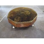 An early Victorian foot stool with ball and claw feet - some wear to fabric, wood in polished