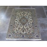 A hand knotted woollen fine Kashan rug - 1.45m x 1.11m - in good condition