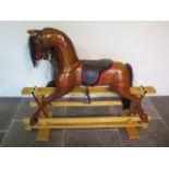 A good quality wooden rocking horse made by White Horses, The Old Exchange, Mill Lane, Welwyn, Herts
