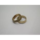 Two hallmarked 9ct yellow gold band rings both size Q - total approx weight 7.9 grams - some usage