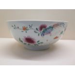 A Chinese floral decorated bowl - height 10cm x diameter 24cm - small chips to rim and base, some