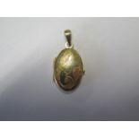 An 18ct yellow gold locket - height 3.5cm - total weight approx 6.5 grams - marked 750 - generally