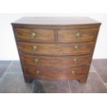 A Goergian inlaid mahogany five drawer bowfronted chest standing on bracket feet - height 102cm x