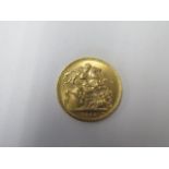 An Elizabeth II gold full Sovereign dated 1964