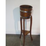 An oak barrell type plantstand by R Alister & Co - height 92cm x diameter 27cm - rickerty, needs