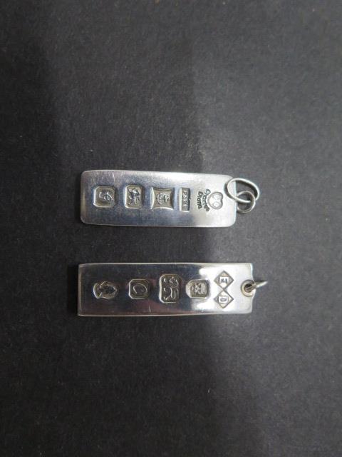 Two silver ingot pendants one commemorating Charles and Diana's wedding - total approx weight 24