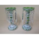 A pair of 20th century overlay green glass lustres - height 26cm - both good condition