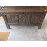 An 18th century carved oak coffer with good patina - height 64cm x 113cm x 43cm