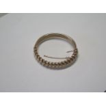 A 10ct rose gold bangle - 6.5cm x 6cm external - approx weight 17.2 grams - some small dents,