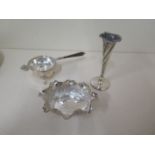 A silver tea strainer on stand, an Easter white metal dish and a small weighted silver vase - height