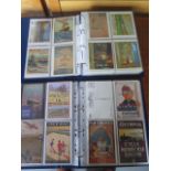 Two albums of reproduction advertising postcards including 90 Drumahoe cards and 129 Mumbles