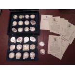 A collection of 26 silver ships and explorers commemorative coins with certificates - boxed -
