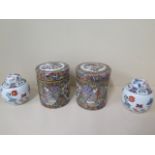 A pair of modern Chinese famille rose lidded canisters - height 15cm and a pair of modern ginger