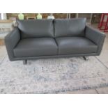 An ex display Italia Living grey leather 2/3 seater sofa, top quality and as new - retails at £