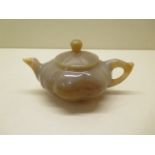 A Chinese 20th century carved agate gould shape teapot and cover - 15cm x 7.5cm - good condition