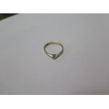 An 18ct yellow gold diamond solitaire ring marked 18ct, ring size N - approx weight 1.5 grams