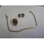 A hallmarked 9ct yellow gold amber ring size G and a 9ct gold 18cm bracelet - clasp good - and a