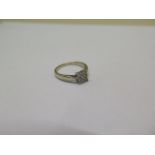 An 18ct hallmarked white gold diamond ring - total approx 0.14ct - ring size J - approx weight 2.5