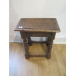An 18th century oak joint stool on turned supports - height 48cm x 41cm x 25cm