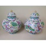 A pair of modern Chinese famille rose lidded vases - height 29cm x width 23cm - both in good