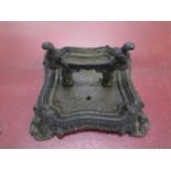 A cast iron footscraper - height 17cm x 30cm x 31cm - generally good