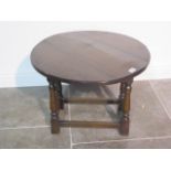 A small oak drop leaf joint stool type table - height 46.5cm, top closed width 26cm , open 60cm