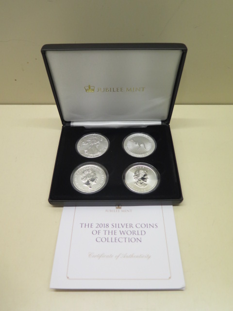 A Jubilee Mint fine silver four Coin of the World Collection - 2018 £2 coin, 2018 Canada 5 Dollar,