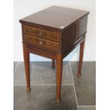 An inlaid mahogany worktable with two active drawers and a lift up top on square tapering legs -