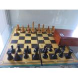 A wooden chess set with box and folding board - height of King 7.5cm - black king missing cross
