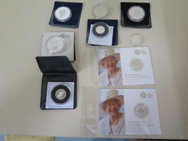 Two fine silver £20 90th Birthday Elizabeth II coins in packets - St George and Dragon silver £1