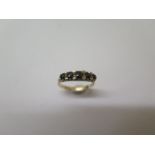 A hallmarked 9ct yellow gold five stone sapphire ring size Q - in generally good condition