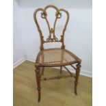A pretty Victorian satinwood side chair with a cane seat - in sound condition