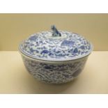 An oriental blue and white lidded tureen - height 19cm x diameter 25cm - in good condition