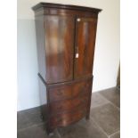 A Georgian style mahogany bowfronted cupboard on three drawer chest - height 162cm x 70cm x 43cm