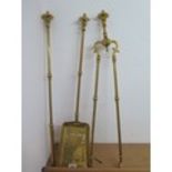 A brass and steel Victorian fire set in polished condition, 67cm tall