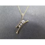 A yellow gold five stone diamond pendant - tests to approx 18ct - on a fine 9ct gold chain - pendant