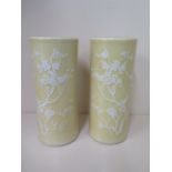 A pair of Oriental cylindrical yellow ground vases with bird and prunus decoration - height 28cm x