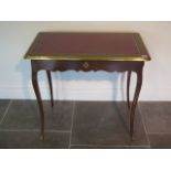 A Continental side table with a leather inset top and a side drawer - height 72cm x 81cm x 49cm
